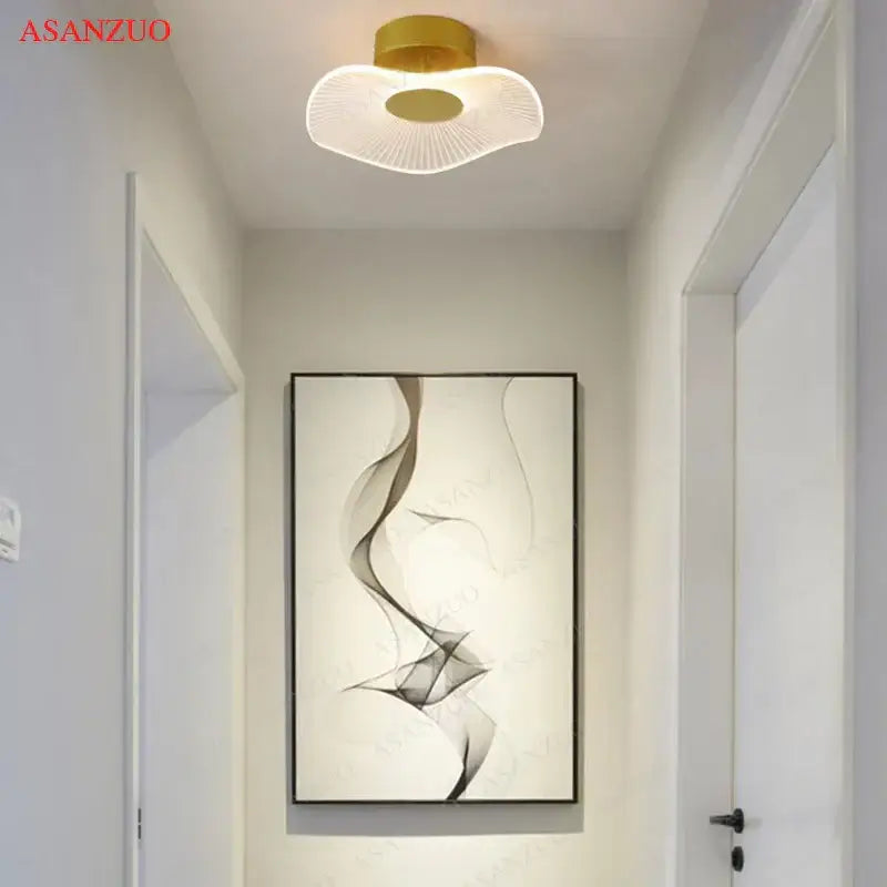 Gold-toned decorbites lotus leaf ceiling light with translucent fan-shaped diffuser and radial led illumination for indoor use
