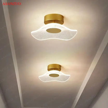 Gold-finished decorbites lotus leaf ceiling light with translucent fan-shaped diffuser and intricate radial pattern