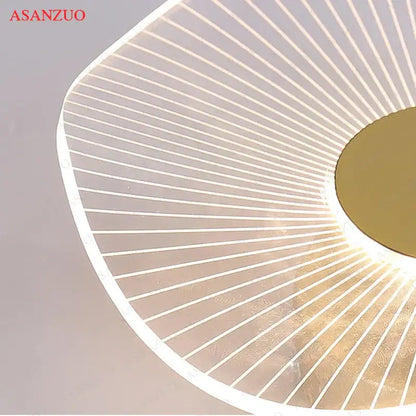 Modern minimalist white and gold decorbites lotus leaf ceiling light with translucent panels emitting warm ambient light