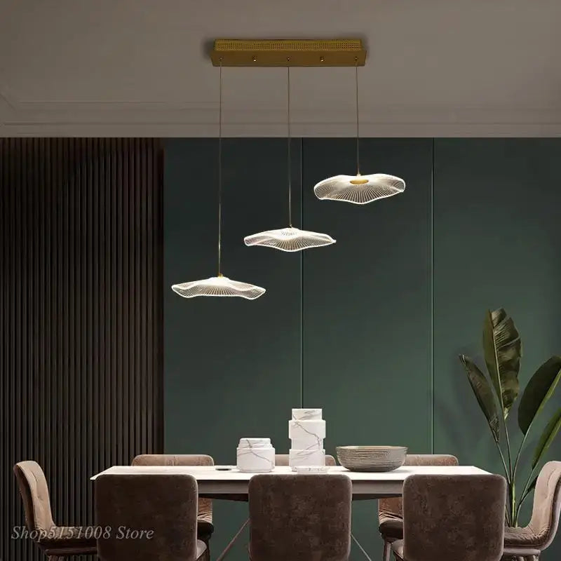 Three elegant white fan-shaped acrylic pendant lights with wireframe design in decorbites lotus leaf chandelier