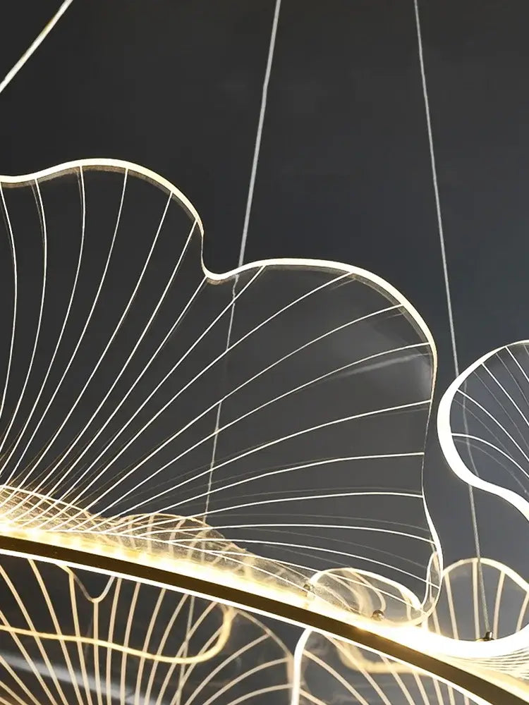 A modern gold-toned decorbites lotus leaf chandelier with illuminated white led vein lines for living room lighting