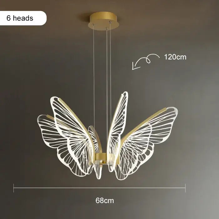 Gold-toned butterfly-shaped pendant light with six illuminated wings in modern decorbites lotus leaf chandelier design