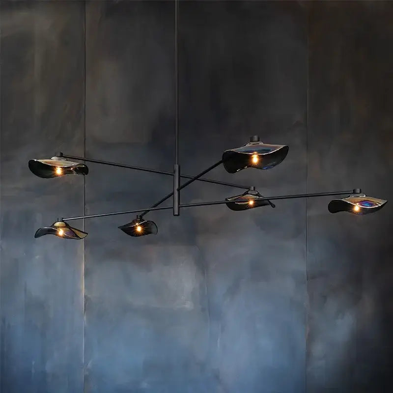 Modern black metal ceiling chandelier with five lotus leaf glass shades emitting warm light by DecorBites Lotus Leaf