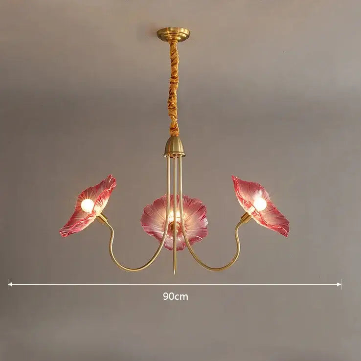 DecorBites lotus leaf glass ceiling chandelier with brass arms and pink glass petals suspended by twisted rope