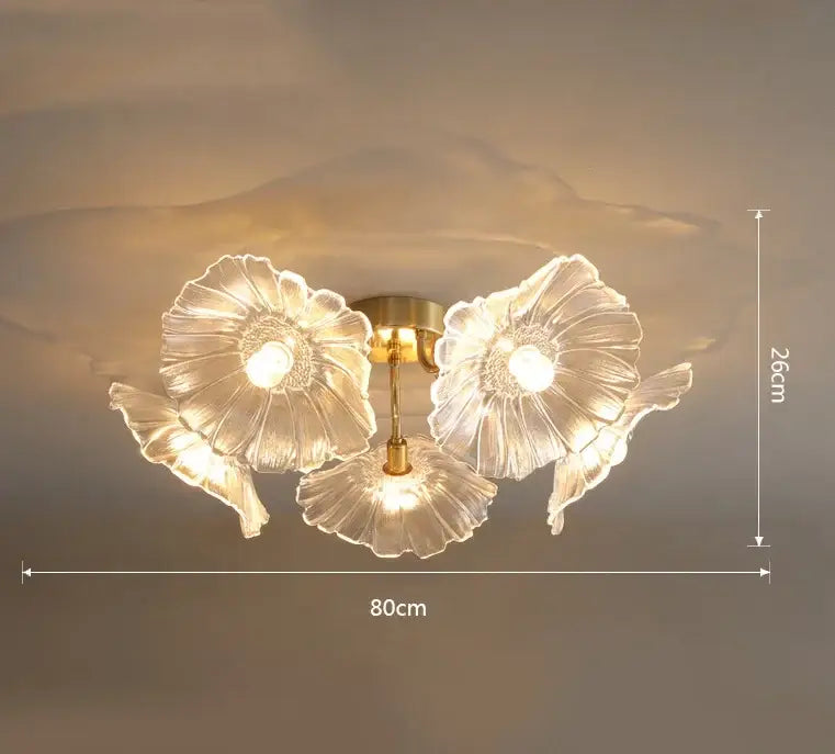 Clear glass flower-shaped ceiling light with gold-toned metal accents from decorbites lotus leaf glass chandelier