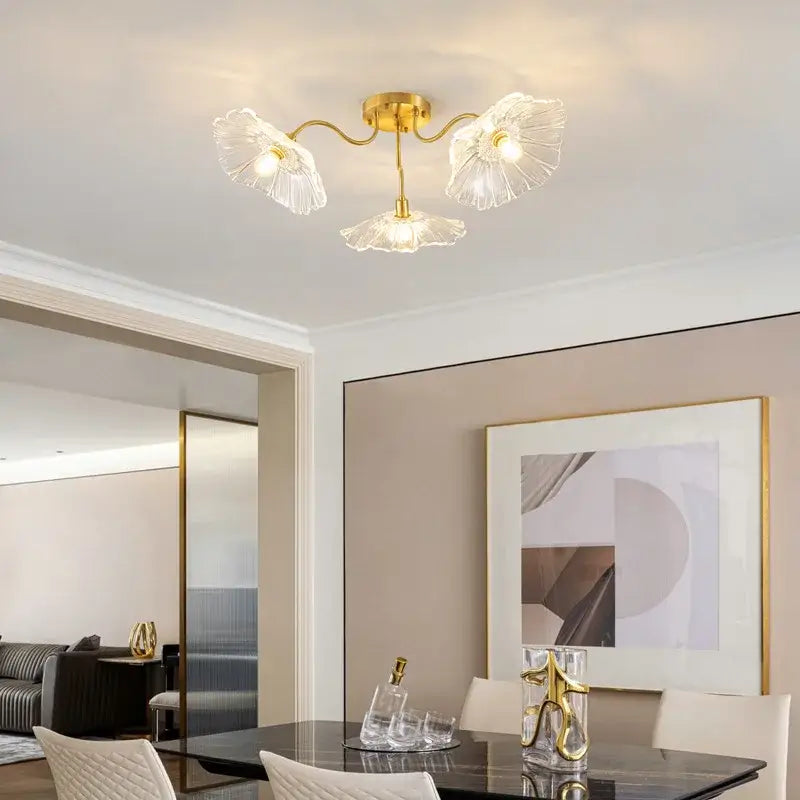 Gold-toned decorbites lotus leaf glass ceiling chandelier with three clear petal-shaped leaf glass shades and e14 bulb
