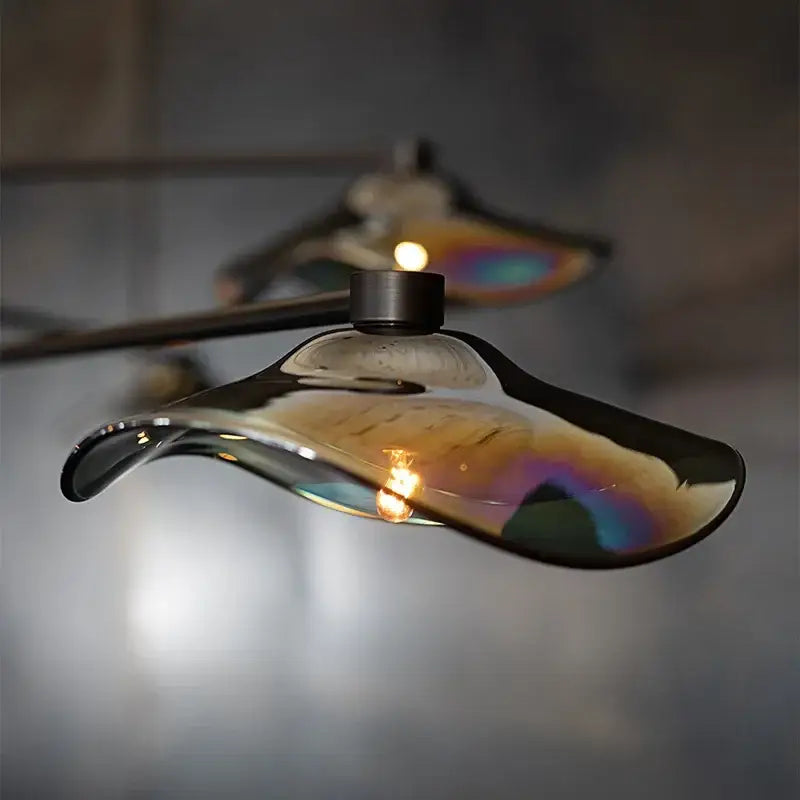 A sleek decorbites lotus leaf glass iron chandelier with iridescent curved pendant light for bedroom and living room lighting