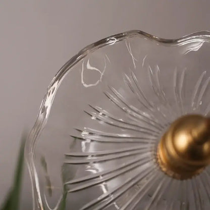 Clear glass pendant light with gold-toned finial and etched lotus leaf glass design by decorbites lotus leaf