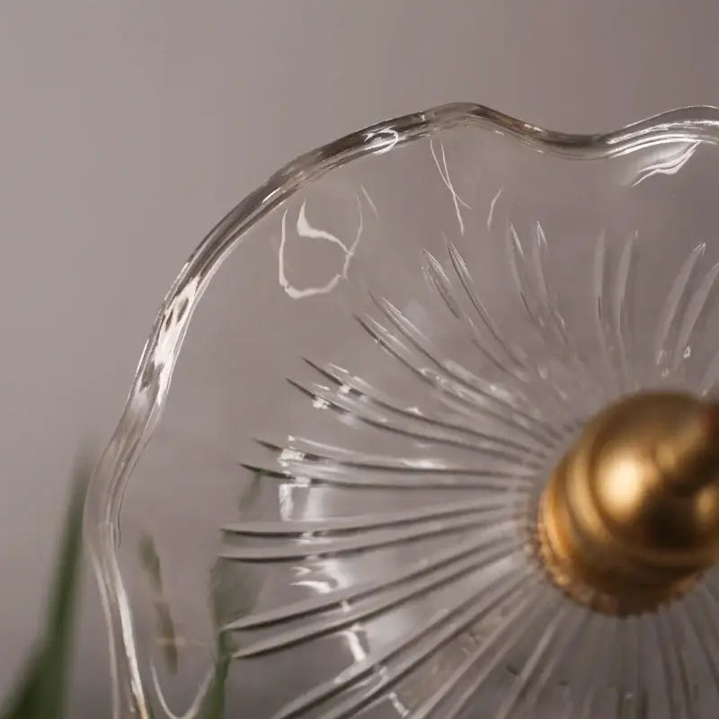 Clear glass pendant light with gold-toned finial and etched lotus leaf glass design by decorbites lotus leaf
