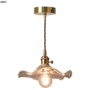 Brass-finished decorbites lotus leaf glass pendant light with twisted brown cord and ornate translucent petals shade