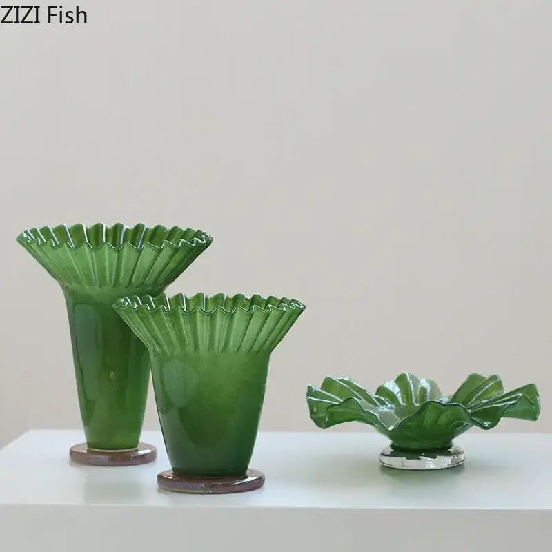 Set of three green ceramic decorbites lotus leaf glass vases with ruffled edges and brown circular bases for elegant decor