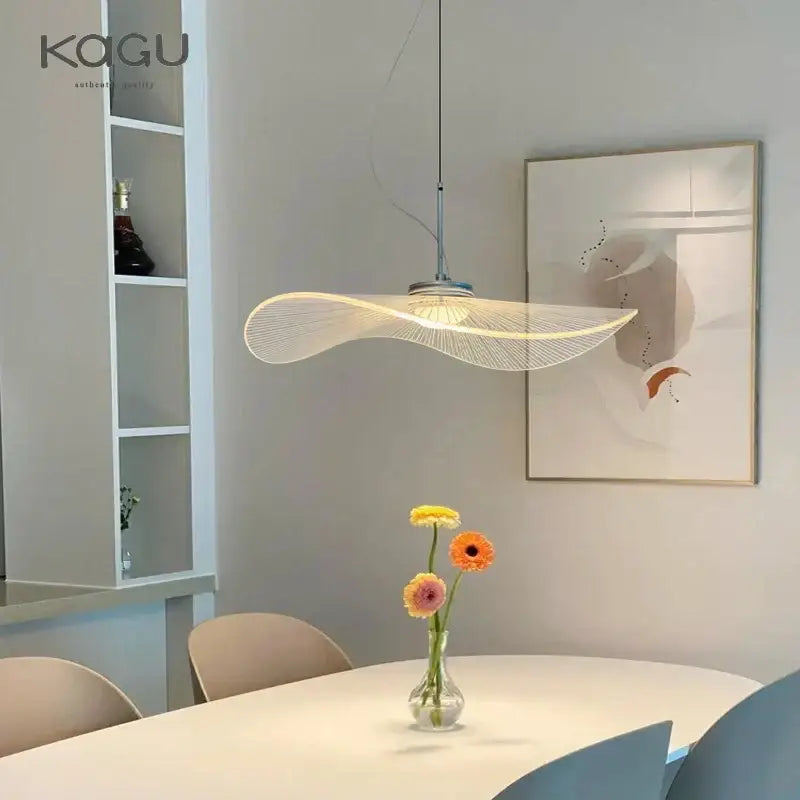 Modern curved pendant light with woven wire design and warm glow from decorbites lotus leaf hat chandelier
