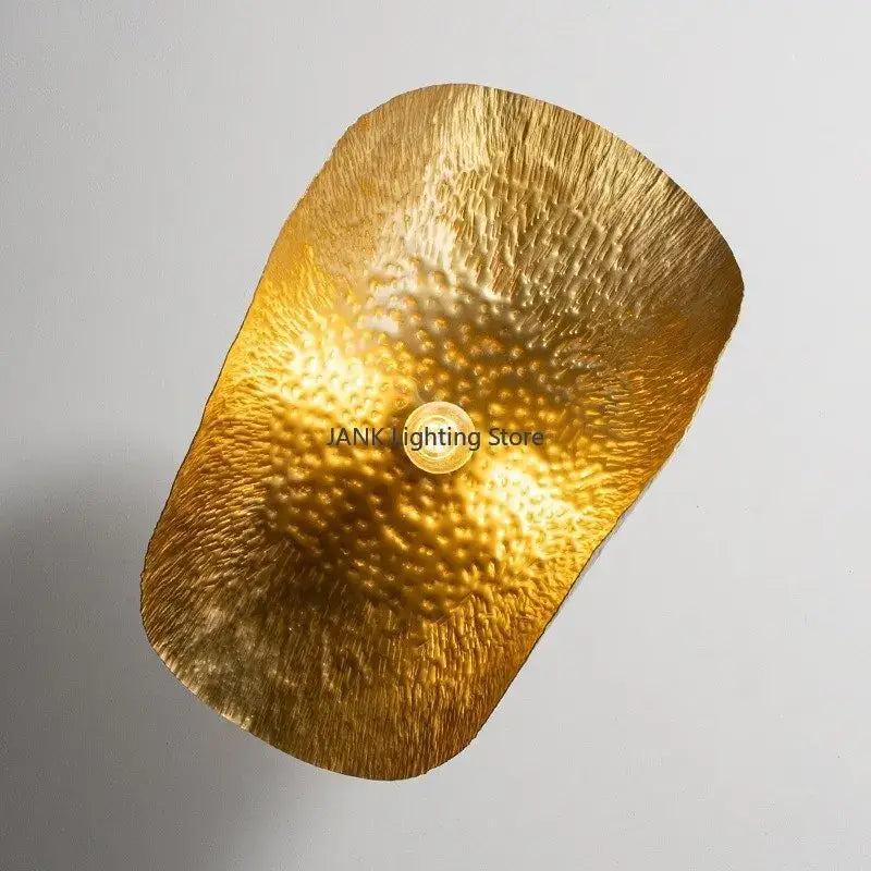 Gold-colored hammered metal pendant lamp with textured organic shape decorbites lotus leaf hat for elegant spaces