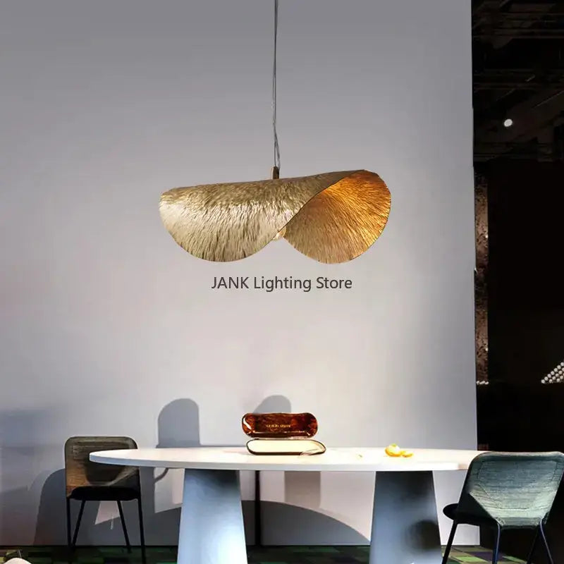 A modern gold-toned decorbites lotus leaf pendant lamp with textured leaf design for living room and restaurant use