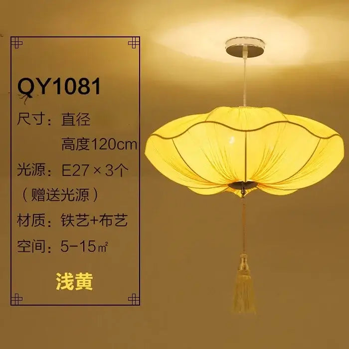 A warm yellow decorbites lotus leaf pendant light with metal frame and fabric shade for kitchen and restaurant use