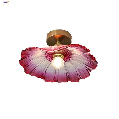 A vibrant pink and purple gradient glass decorbites lotus leaf led ceiling lamp with brass-finished mounting base