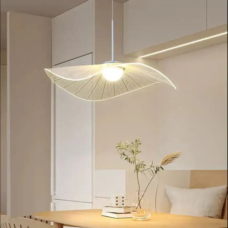A modern minimalist decorbites lotus leaf pendant light with white metal wires and lotus leaf led design for living spaces