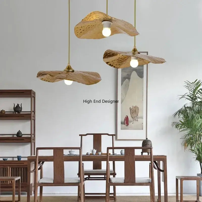 Three golden-brown bamboo lotus leaf led pendant lights with brass accents by decorbites for modern home décor