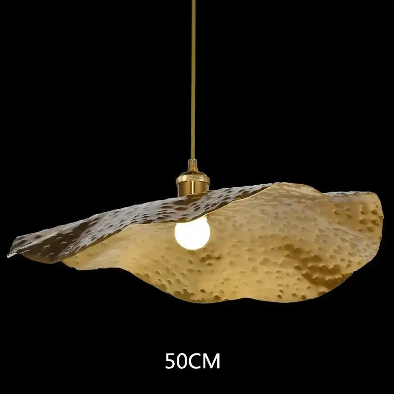 Gold-colored hammered metal pendant light with textured lotus leaf led design by decorbites lotus leaf chandelier