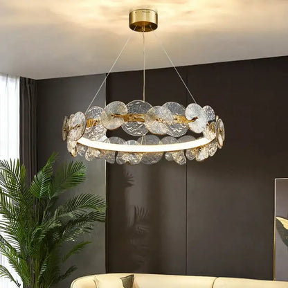 Elegant gold-toned decorbites lotus leaf LED chandelier with translucent fan-shaped glass discs for living room lighting