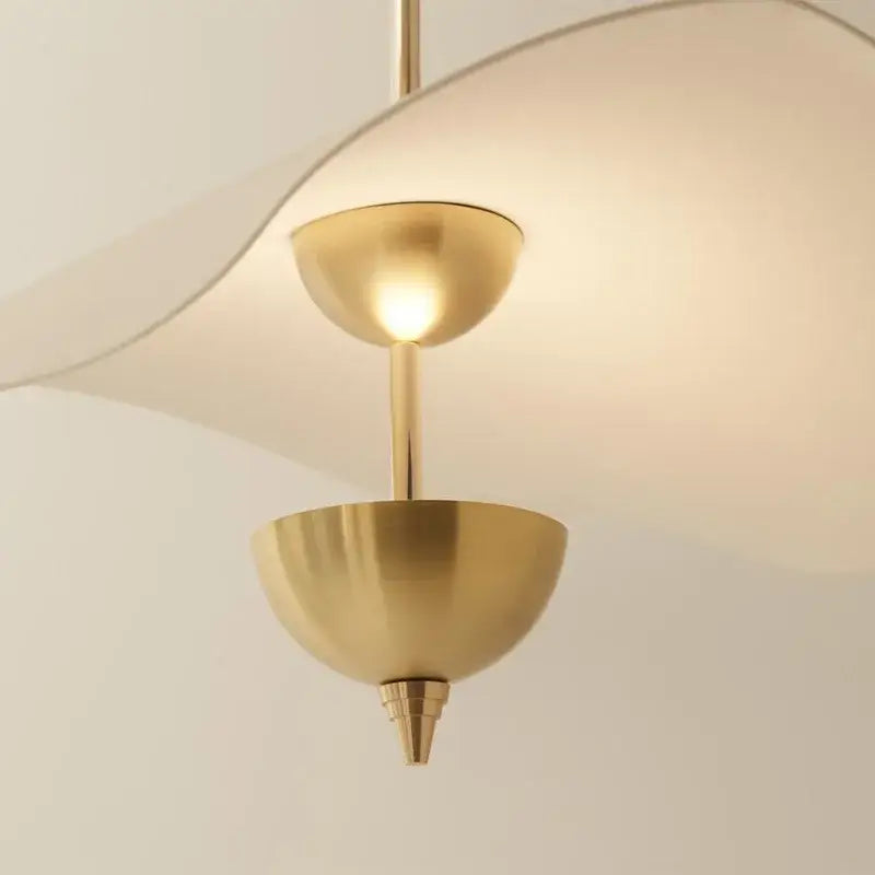 A modern brass pendant lamp with two dome-shaped fixtures in the decorbites lotus leaf collection for luxury decor