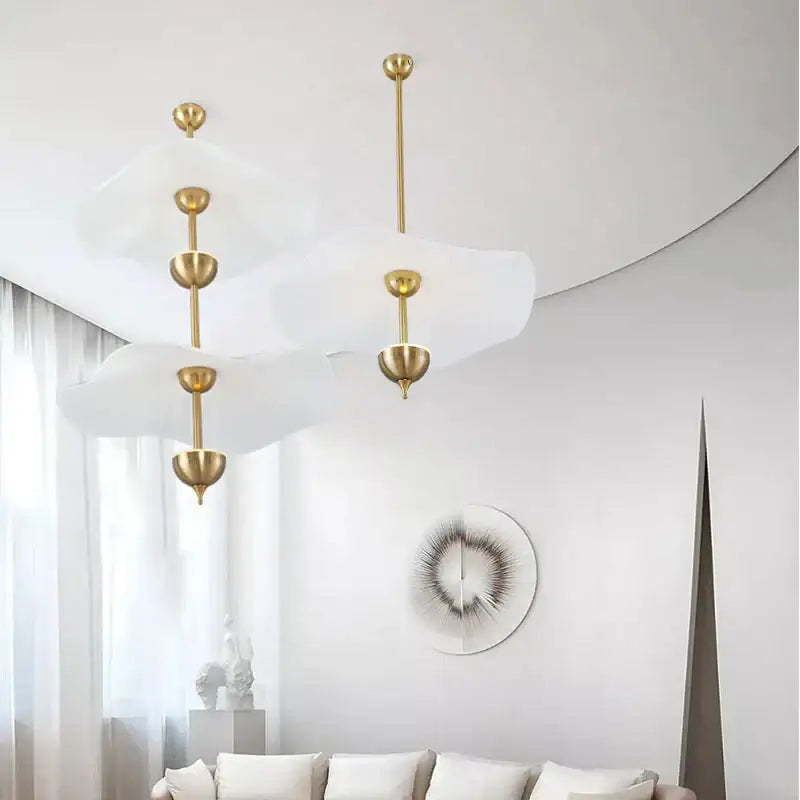 Modern decorbites lotus leaf pendant lamp with gold-toned metal fixtures and white diffusers for luxury living room decor