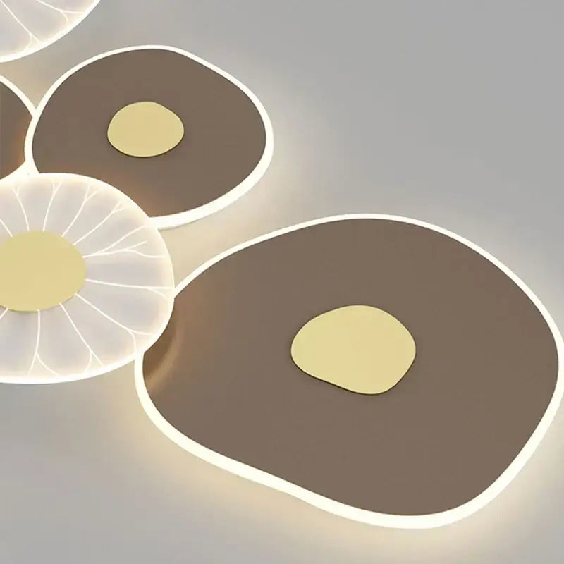 Decorbites™ lotus leaf led wall light with sleek matte brown and translucent white leaves and warm gold centers