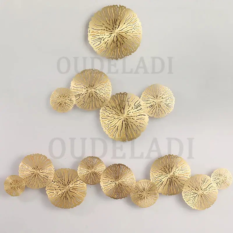 Gold-colored decorbites lotus leaf led wall sconce with intricately cut metal in a decorative copper industrial design