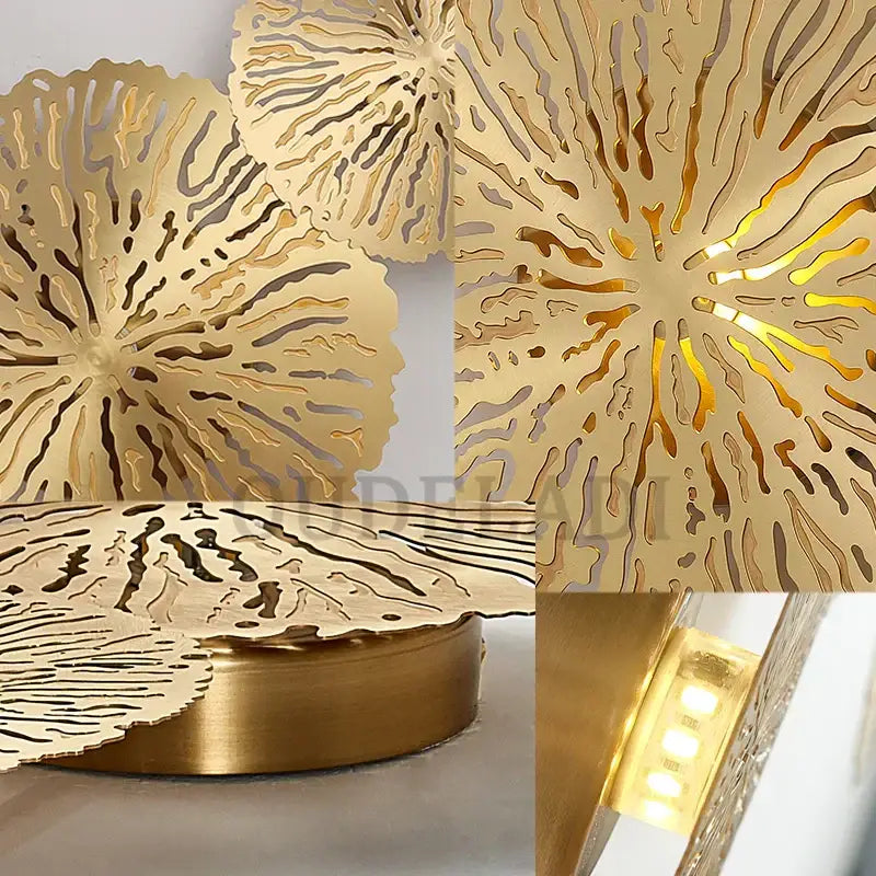 Gold-colored decorbites lotus leaf led wall sconce in copper metal with intricate cut design and embedded lighting