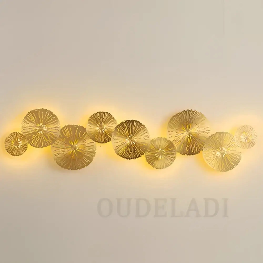DecorBites lotus leaf led wall sconce in copper with golden metallic leaf design and warm back glow for industrial decor