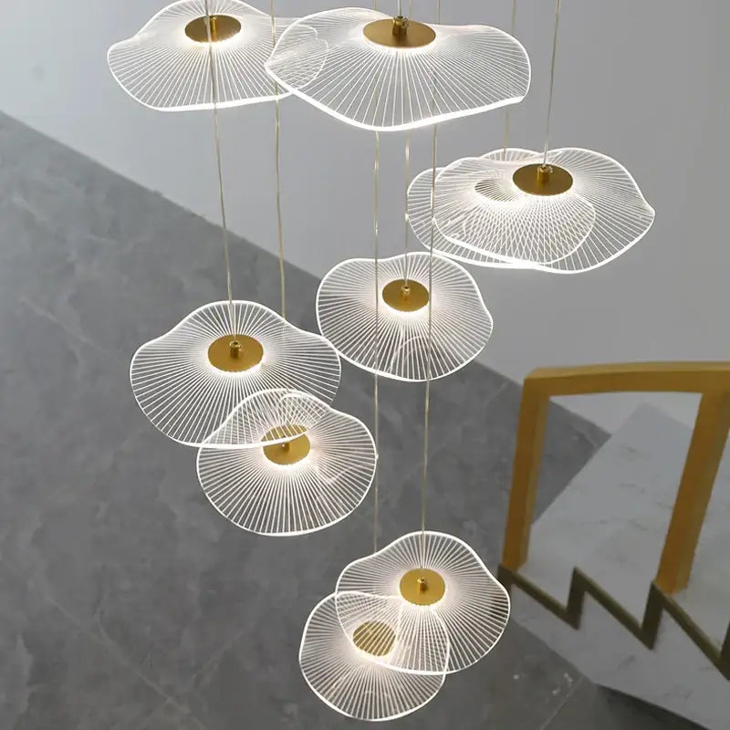 Modern white acrylic DecorBites lotus leaf Nordic chandelier with gold-toned accents and a delicate fan-like design