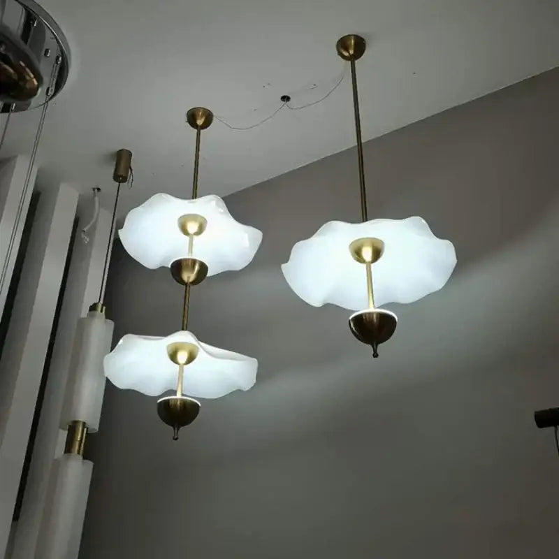White cloud-like glass pendant lamp with brass accents from decorbites lotus leaf pendant for home and restaurant lighting