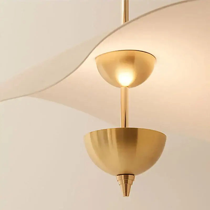 A modern gold metal pendant lamp with curved design and two dome fixtures decorbites lotus leaf pendant lamp