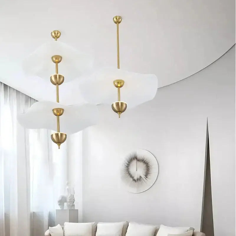 Gold-toned decorbites lotus leaf pendant lights with translucent diffusers and brass rods for modern ceiling chandelier