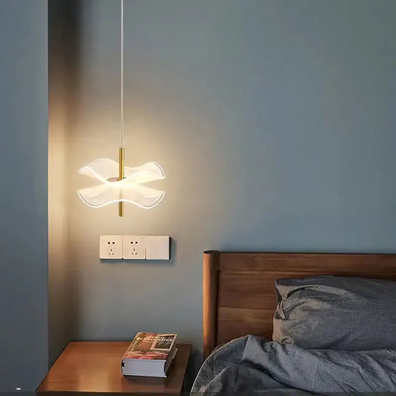 A modern decorbites lotus leaf pendant light with translucent petal-shaped glass shade and slender gold metal stem