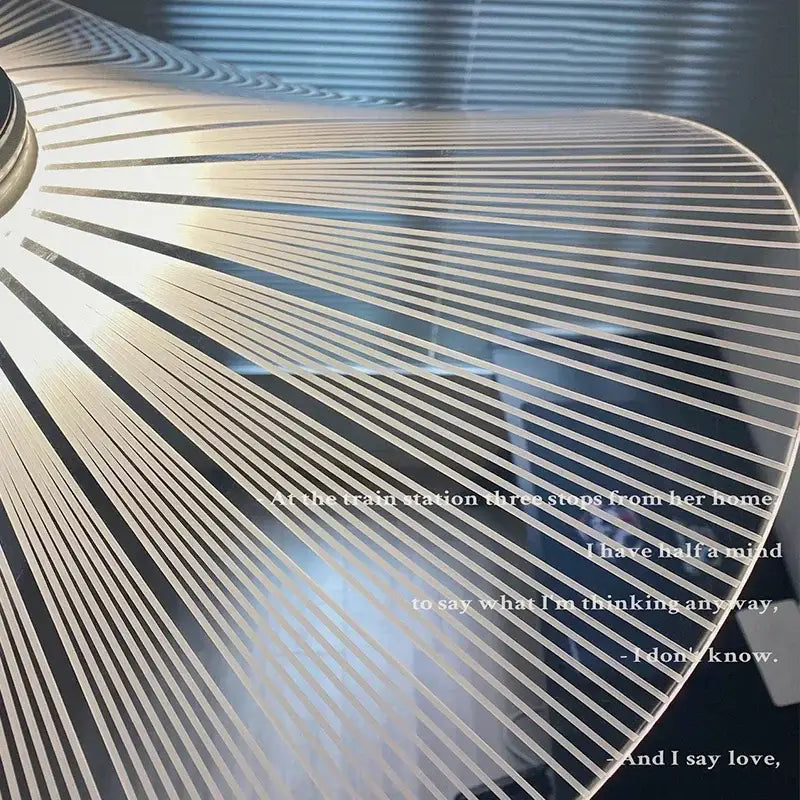 A sleek translucent acrylic pendant light with metallic silver lines in decorbites lotus leaf pendant design