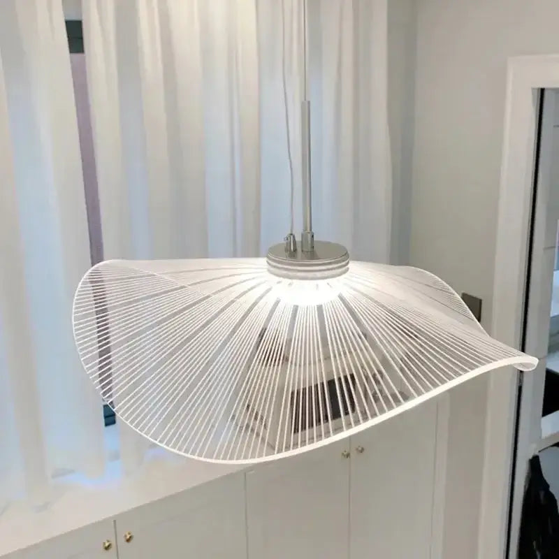 A modern white decorbites lotus leaf pendant light with sleek thin metal wires radiating from a circular base