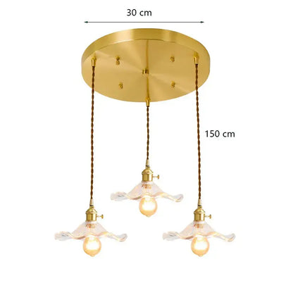 Gold-toned decorbites lotus leaf pendant lights with three floral glass shades and twisted copper cords for modern interiors
