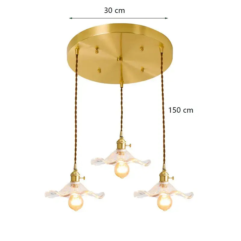 Gold-toned decorbites lotus leaf pendant lights with three floral glass shades and twisted copper cords for modern interiors