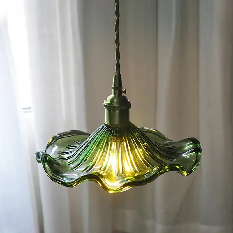 Green hand-blown glass pendant light with fluted lotus leaf design and brass hardware decorbites lotus leaf pendant