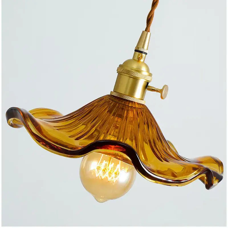 Amber-colored hand-blown glass lotus leaf pendant light with brass socket and twisted cord by decorbites lotus leaf pendant lights