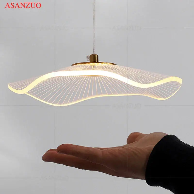 Modern gold-toned decorbites lotus leaf single pendant lamp with a sleek wave-shaped design and illuminated led strip