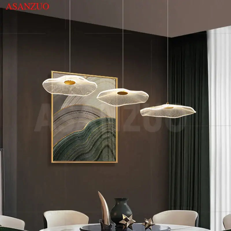 Three modern white fan-shaped pendant lamps with gold centers from decorbites lotus leaf single pendant lamp