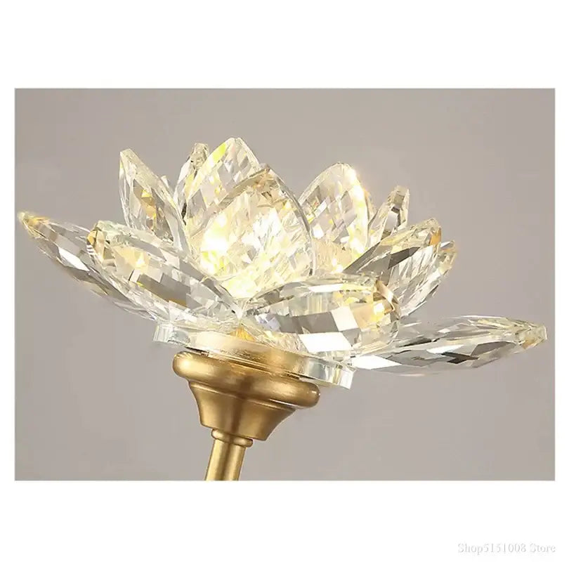 A decorbites lotus led wall lamp featuring crystal lotus shape with faceted transparent crystals and gold metal base