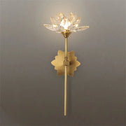 Delicate gold-toned decorbites lotus led wall lamp with crystal lotus design and ornate leaf base for bedroom decor