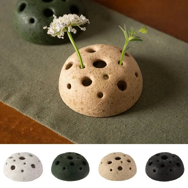 Beige stone sand ceramic vase with lotus seedpod design and textured surface holding two small plants by DecorBites™