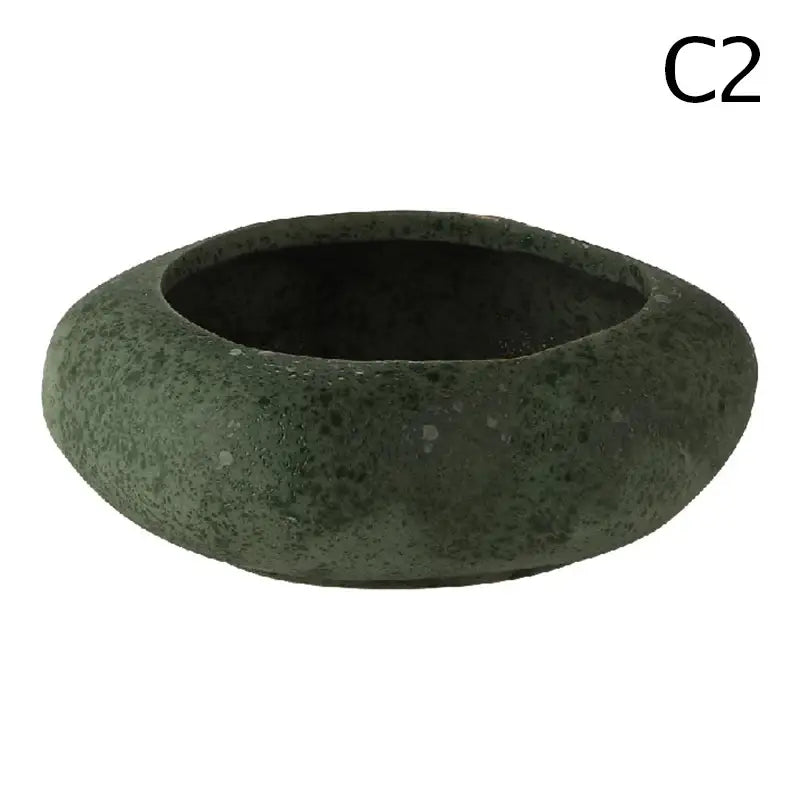 A rustic dark green stone sand ceramic vase in decorbites™ lotus seedpod set with speckled texture and smooth edges