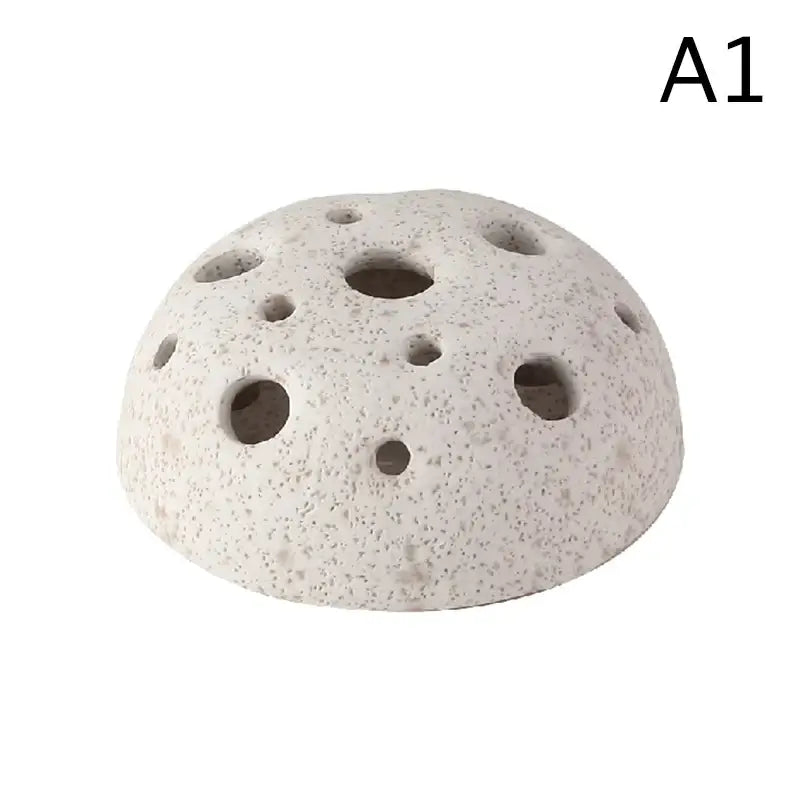 DecorBites™ lotus seedpod ceramic vase set featuring a white speckled volcanic stone sand diffuser with circular holes