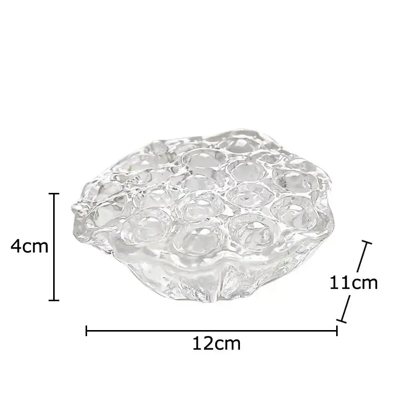 Clear glass decorative tray with textured bubble surface and irregular edges in decorbites lotus seedpod resin sculpture style