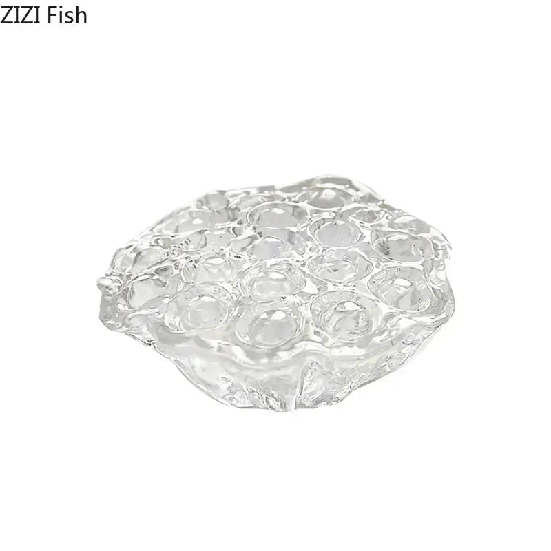 Clear glass egg holder with textured bubble surface complementing decorbites lotus seedpod resin sculpture desk decor
